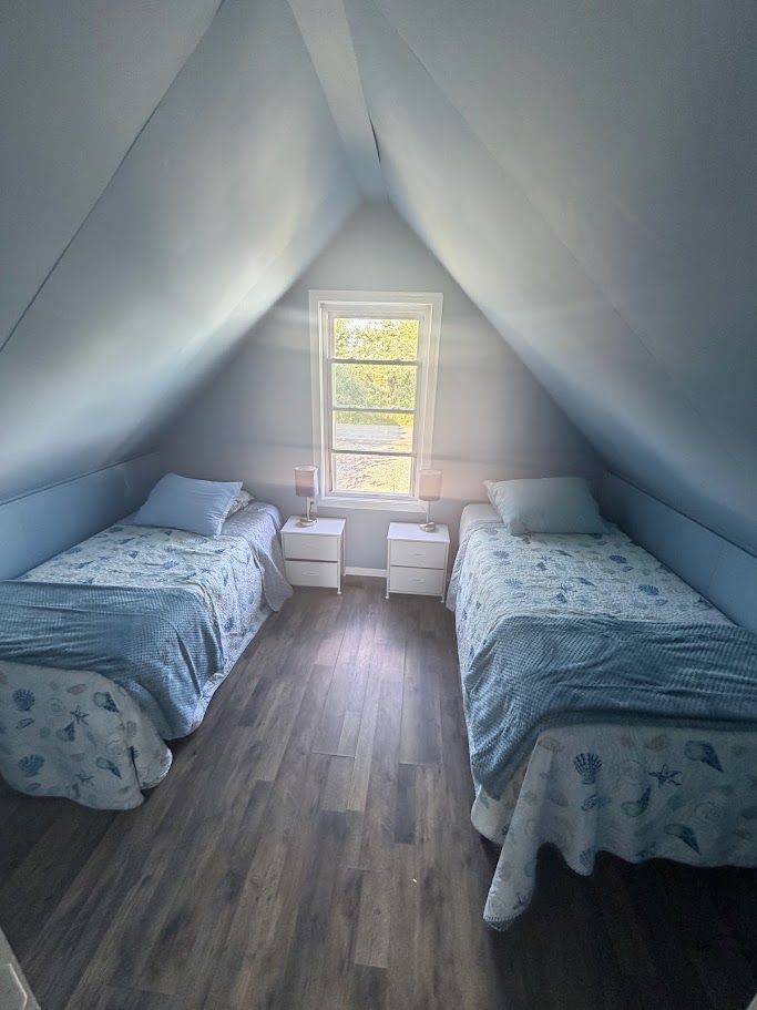 Bedroom with navy polka-dot bedding